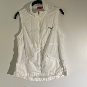 Puma golf vest. White w blue and green logo SizeL